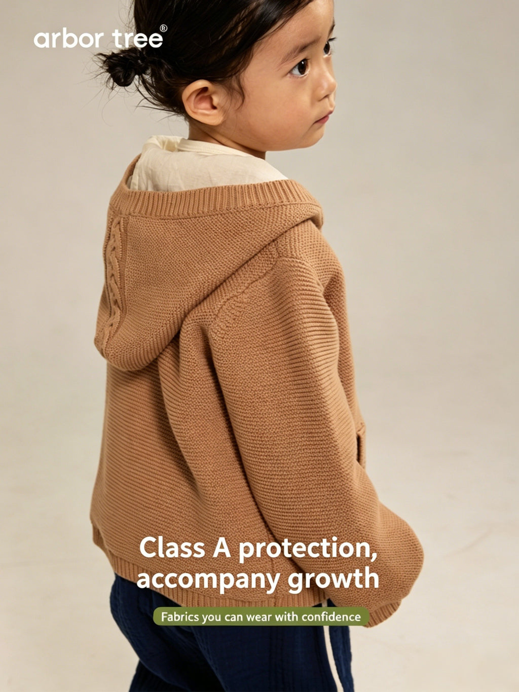 Unisex kids' ArborTree organic cotton knit hooded jacket with warm lining, suitable for spring, fall, and winter seasons.