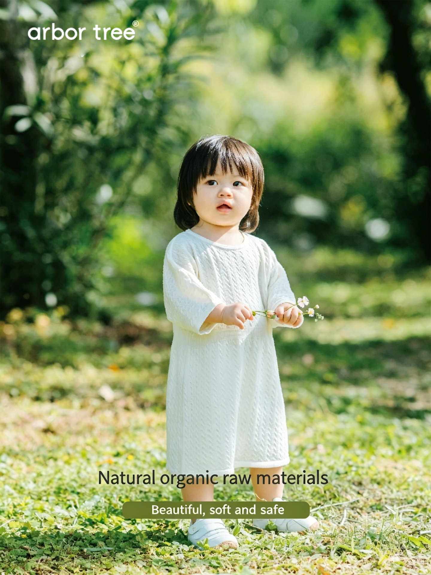 Soft ArborTree 100% Merino superfine wool baby dress in natural cream, featuring a cozy, gentle fabric perfect for infants.
